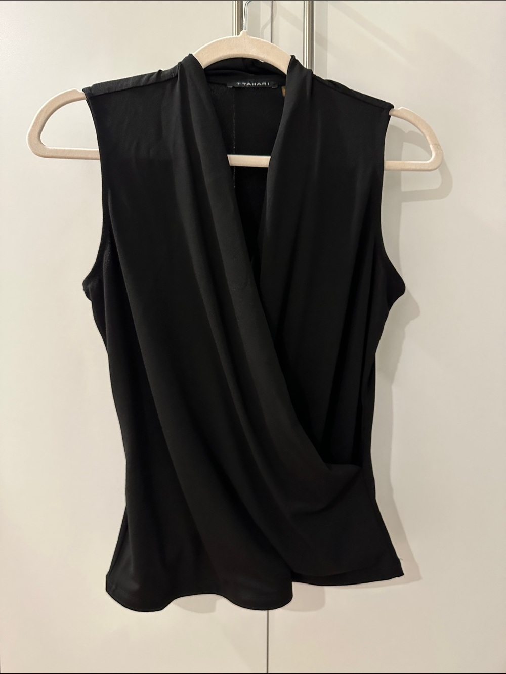 Worn twice. Tahari Black Sleeveless Draped Surplice top